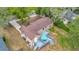 Aerial perspective of home with a deck and nice roof surrounded by green trees at 150 Debary Dr, Debary, FL 32713