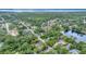 Beautiful community aerial view of homes and Lake Tarpon surrounded by lush greenery at 150 Debary Dr, Debary, FL 32713