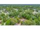 Aerial view of a home with a red boundary, nestled within lush greenery, offering a serene and private setting at 150 Debary Dr, Debary, FL 32713
