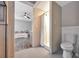 Bathroom with open shower, neutral paint, wood look floors and fixtures at 150 Debary Dr, Debary, FL 32713