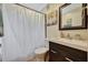 Bathroom featuring a modern vanity, mirror, shower with curtain, and tile flooring at 150 Debary Dr, Debary, FL 32713