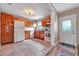Bright kitchen with tile flooring, wood cabinets, and a view to the living space at 150 Debary Dr, Debary, FL 32713