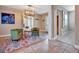 Inviting living room with stylish decor, featuring a colorful rug, chairs, and modern lighting at 150 Debary Dr, Debary, FL 32713