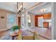 Inviting living room flowing into kitchen, featuring hardwood floors and modern lighting at 150 Debary Dr, Debary, FL 32713