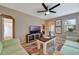 Spacious living room offering bright decor, tile flooring, and access to other rooms at 150 Debary Dr, Debary, FL 32713