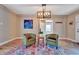 Well-decorated room with modern light fixture, chairs, a rug, and neutral colored walls at 150 Debary Dr, Debary, FL 32713