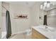 Contemporary bathroom featuring a shower/tub combo and a sleek vanity with modern fixtures at 17349 Serenidad Blvd, Clermont, FL 34714
