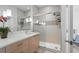 Modern bathroom with a glass-enclosed shower, vanity, and contemporary finishes at 17349 Serenidad Blvd, Clermont, FL 34714