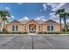 Front of the community clubhouse with gated entrance and parking at 17349 Serenidad Blvd, Clermont, FL 34714