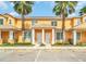 Inviting two-story townhome featuring a landscaped yard and convenient parking at 17349 Serenidad Blvd, Clermont, FL 34714