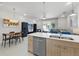 Bright kitchen with stainless steel appliances open to the living area at 17349 Serenidad Blvd, Clermont, FL 34714