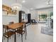 Open living and dining area with views of the screened-in patio and pool at 17349 Serenidad Blvd, Clermont, FL 34714