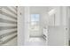Bright bathroom showcasing stylish shower with gray-striped tiling and sleek vanity at 1761 Legion Dr, Winter Park, FL 32789