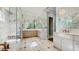 This bathroom features marble walls and floors, a spacious walk-in shower, and dual vanities with modern fixtures at 1761 Legion Dr, Winter Park, FL 32789