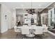 Stunning dining room with an oval marble table, modern lighting, and mirrored wall at 1761 Legion Dr, Winter Park, FL 32789