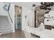Open dining area with modern lighting, an oval marble table, and a glass-enclosed wine cellar at 1761 Legion Dr, Winter Park, FL 32789