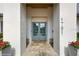 Grand entrance with stone floor, double glass doors, and modern planters flanking the walkway at 1761 Legion Dr, Winter Park, FL 32789