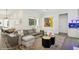 Elegant living room with hardwood floors, contemporary furniture, and bright, modern artwork at 1761 Legion Dr, Winter Park, FL 32789