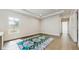 Bright living room featuring decorative rug, tray ceiling and recessed lighting at 1761 Legion Dr, Winter Park, FL 32789