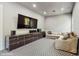 Cozy living room featuring modern media cabinet, comfortable seating, and geometric carpet at 1761 Legion Dr, Winter Park, FL 32789