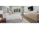 This main bedroom features a tufted headboard, neutral tones, and sliding doors to the backyard at 1761 Legion Dr, Winter Park, FL 32789