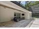 Spacious covered patio with outdoor seating and a view of the landscaped backyard at 1761 Legion Dr, Winter Park, FL 32789