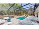 Enjoy this covered pool area with plenty of lounging space, perfect for relaxation or entertaining guests at 1761 Legion Dr, Winter Park, FL 32789