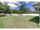 Spacious backyard features lush green grass and a privacy fence, perfect for outdoor activities at 177 Bristol Forest Trl, Sanford, FL 32771
