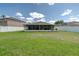 Well-maintained backyard with screened patio offers ample space for relaxation and recreation at 177 Bristol Forest Trl, Sanford, FL 32771