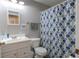 The bathroom has a well-maintained white sink and cabinet with an adjacent shower at 177 Bristol Forest Trl, Sanford, FL 32771