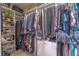 This large walk-in closet features ample space to store an extensive wardrobe and accessories at 177 Bristol Forest Trl, Sanford, FL 32771