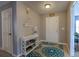 Inviting entryway with decorative console table and teal patterned rug at 177 Bristol Forest Trl, Sanford, FL 32771