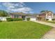 Beautiful single-story home featuring a lush green lawn and two car garage at 177 Bristol Forest Trl, Sanford, FL 32771