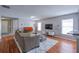 Spacious living room featuring wood floors, plush rug, and neutral decor at 177 Bristol Forest Trl, Sanford, FL 32771