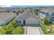 Aerial view of a well-kept home with a lush green lawn and tidy landscaping in a suburban community at 1866 Cassidy Knoll Dr, Kissimmee, FL 34744
