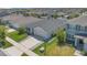 Aerial shot of a single-Gathering home in a residential neighborhood, showcasing its well-maintained lawn and surroundings at 1866 Cassidy Knoll Dr, Kissimmee, FL 34744