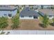 Aerial view of backyard, featuring a covered patio and a spacious yard at 1866 Cassidy Knoll Dr, Kissimmee, FL 34744