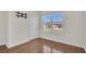 Bright bedroom features beautiful wood floors, a large window, and a TV wall mount at 1866 Cassidy Knoll Dr, Kissimmee, FL 34744