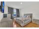 Bedroom with gray color palatte, wood floors, and natural light from window at 1866 Cassidy Knoll Dr, Kissimmee, FL 34744