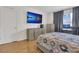 Comfortable bedroom with a mounted television and computer desk at 1866 Cassidy Knoll Dr, Kissimmee, FL 34744