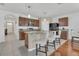 Modern kitchen features a center island with counter seating and stainless steel appliances at 1866 Cassidy Knoll Dr, Kissimmee, FL 34744