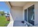 Covered patio includes sliding glass doors and potted plants at 1866 Cassidy Knoll Dr, Kissimmee, FL 34744