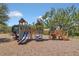 Community playground with slides, climbing structures, and benches for relaxing at 1866 Cassidy Knoll Dr, Kissimmee, FL 34744