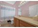 This bathroom features a shower-tub combo and a vanity at 1868 Rachels Ridge Loop # L, Ocoee, FL 34761