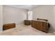 Spacious bedroom features vintage dressers, carpet floors, and a sunny window at 1868 Rachels Ridge Loop # L, Ocoee, FL 34761