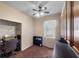 Cozy room with desk and closet is illuminated by natural light with a ceiling fan at 1868 Rachels Ridge Loop # L, Ocoee, FL 34761