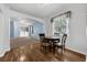 Eat-in kitchen/dining area with hardwood floors, natural light and table with four chairs at 1868 Rachels Ridge Loop # L, Ocoee, FL 34761