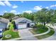 Landscaped single-story home on a corner lot with a long driveway and well-maintained front lawn at 1868 Rachels Ridge Loop # L, Ocoee, FL 34761
