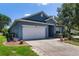 Charming single-story home with a well-maintained lawn and driveway at 1868 Rachels Ridge Loop # L, Ocoee, FL 34761
