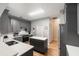 Well-lit kitchen showcasing gray cabinetry, stainless steel appliances and a central island at 1868 Rachels Ridge Loop # L, Ocoee, FL 34761